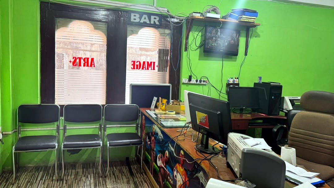 Customer seating area and counter at the Image Arts shop in Thimphu